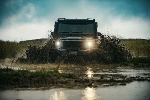 Offroad vehicle driving through mud